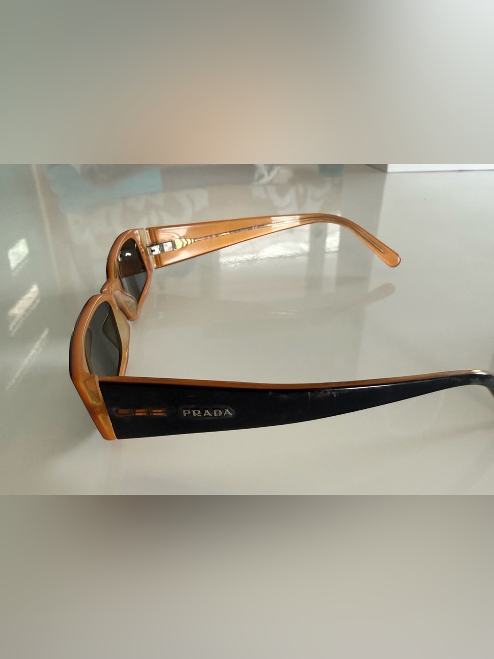 Authentic Prada Sunglasses - black & orange Frame with new replacement lens